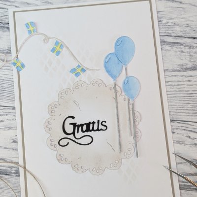 LITEN SNIRKLIG GRATTISstansmall från Gummiapan ca 35 x 21 mm